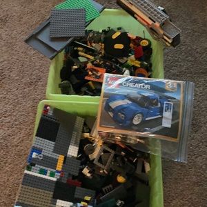 30 lbs of Lego pieces and 7 manuals